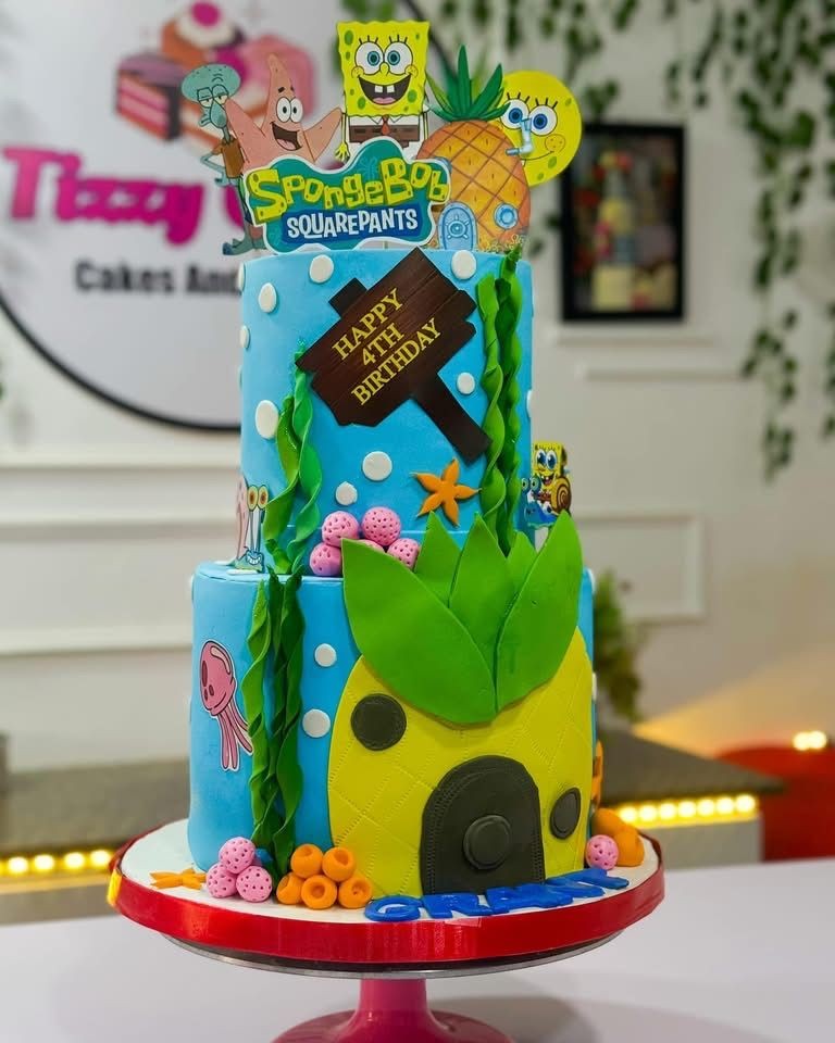 SpongeBob SquarePants themed birthday cake with ocean and character decorations.