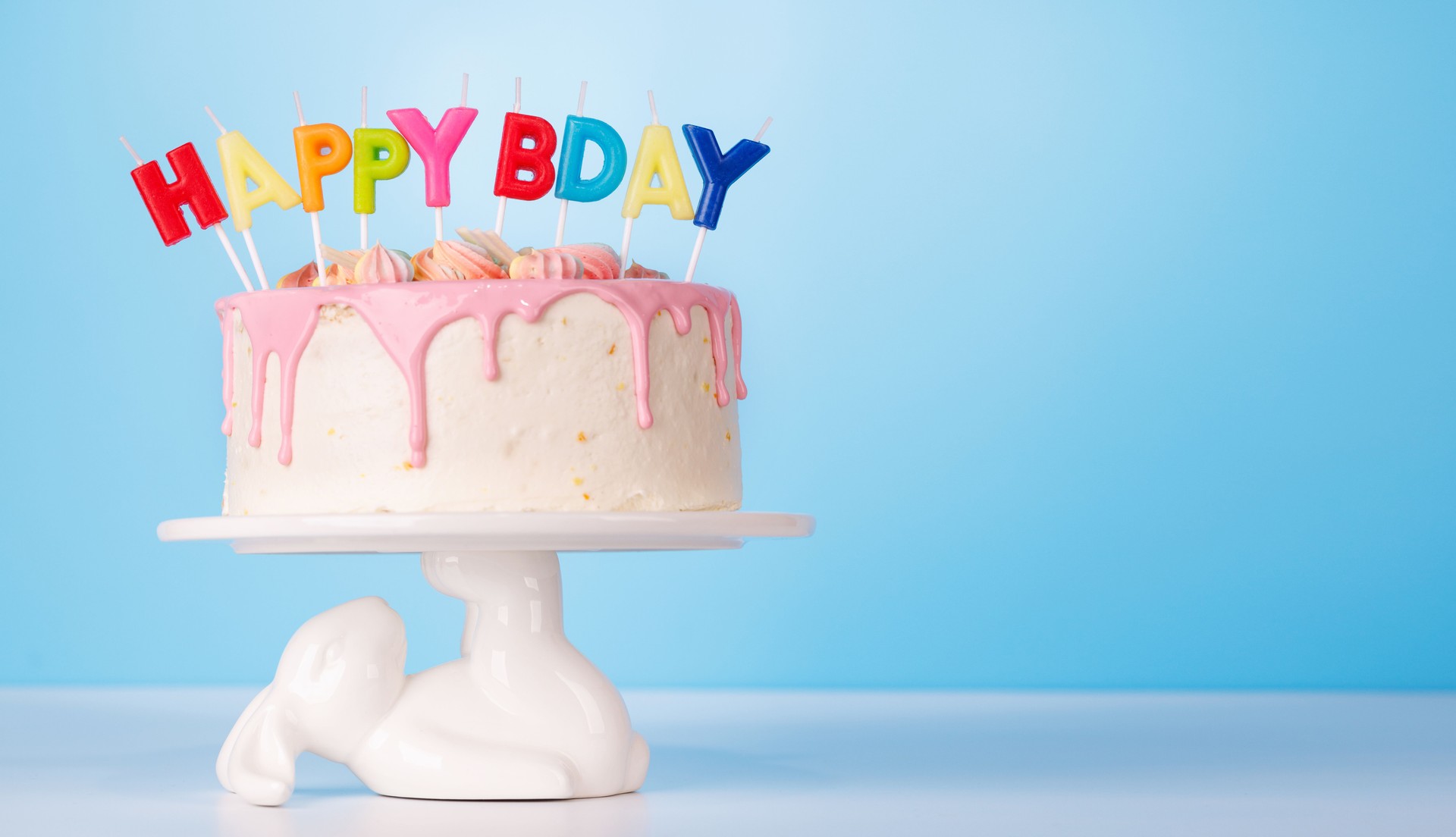 A festive birthday cake topped with colorful candles